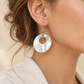 Tongan Shell Earrings — AI-generated model styling; scale illustrative
