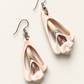 Cross-cut Shell Earrings — AI-restyled studio presentation based on the original product photograph