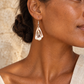 Cross-cut Shell Earrings worn by a model - AI-assisted styling illustration; scale is illustrative. Original product photographs are included in the gallery.