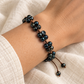 AI-generated styling illustration of Cultured Black Baroque Pearls Woven Bracelet worn by a model. Refer to original product photographs for details; scale is illustrative.