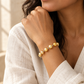 AI-generated styling illustration of Golden South Sea Cultured  Pearl Bracelet 7-9mm worn by a model. Refer to original product photographs for details; scale is illustrative.