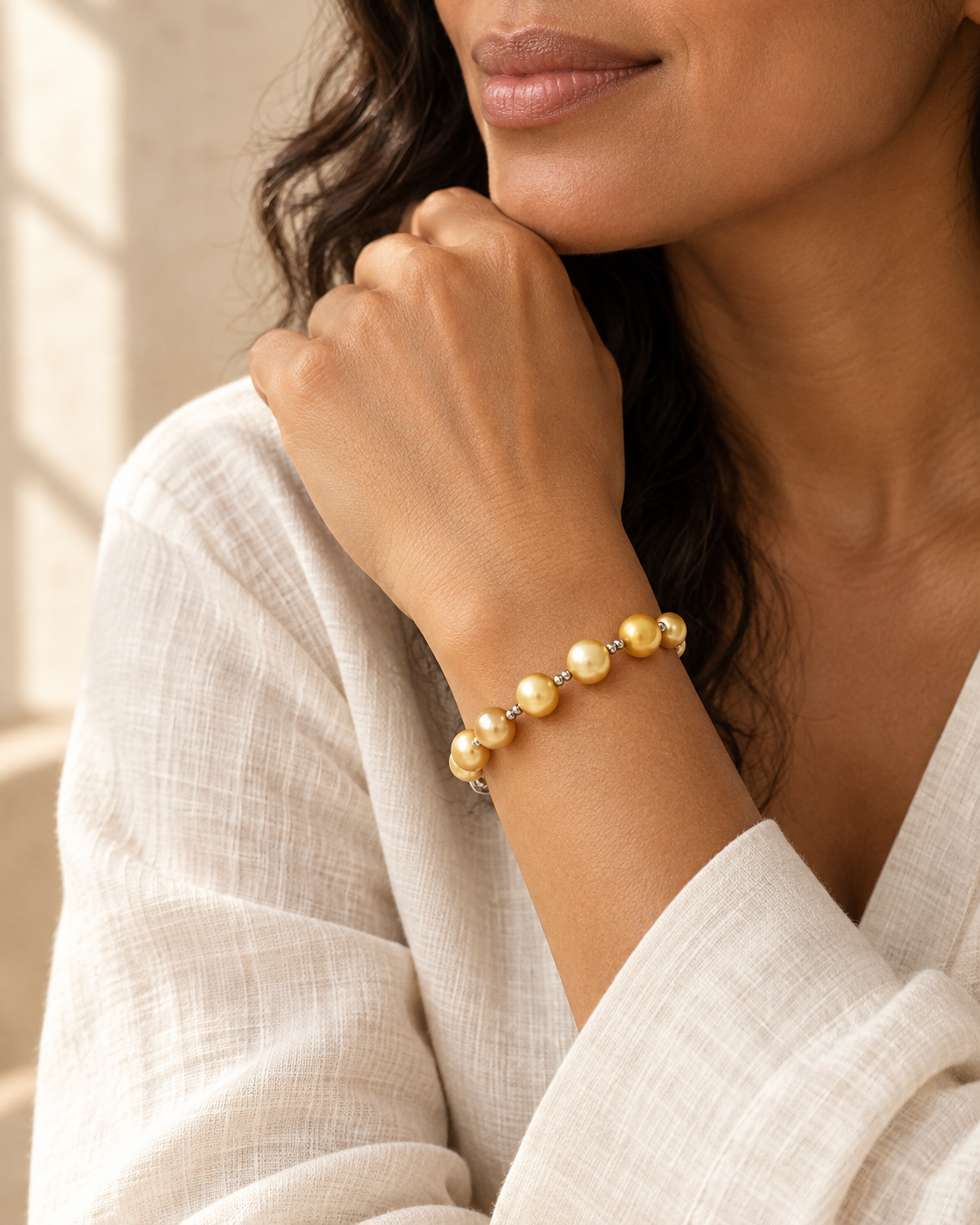 AI-generated styling illustration of Golden South Sea Cultured  Pearl Bracelet 7-9mm worn by a model. Refer to original product photographs for details; scale is illustrative.