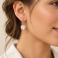 Mini Floral Shell Earrings worn by a model - AI-assisted styling illustration; scale is illustrative. Original product photographs are included in the gallery.