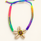 Braided Rainbow Bracelet With Shells — AI-restyled studio presentation based on the original product photograph