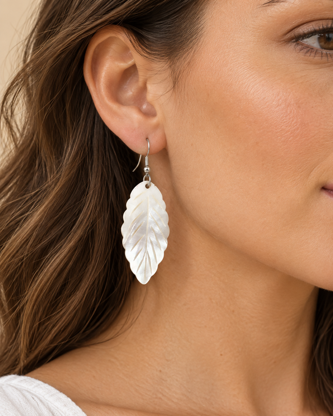 AI-generated styling illustration of Leaf-Shaped Mother of Pearl Shell Earrings worn by a model. Refer to original product photographs for details; scale is illustrative.